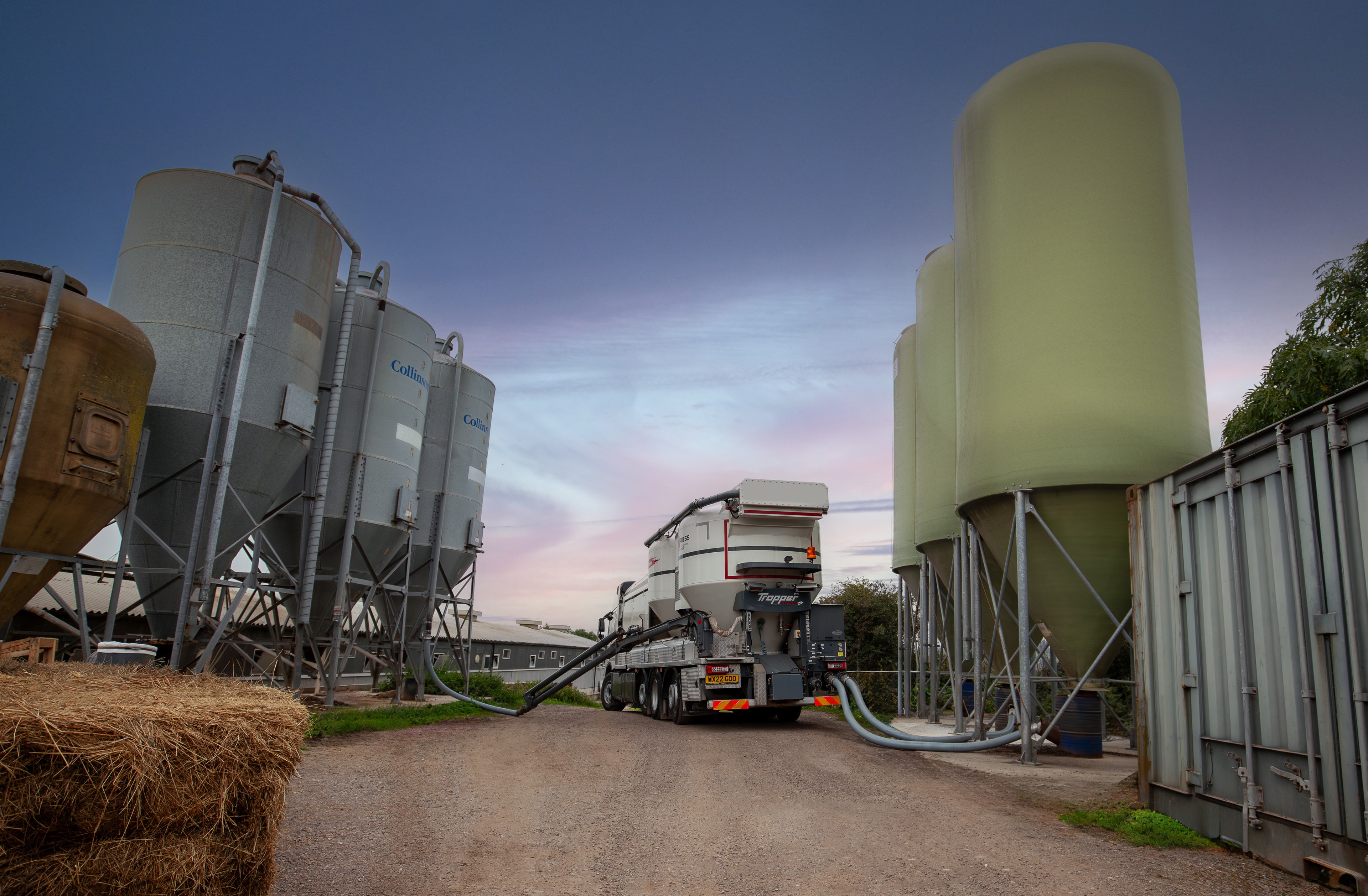Green Circle Feeds Twin Power truck on a farm lane
